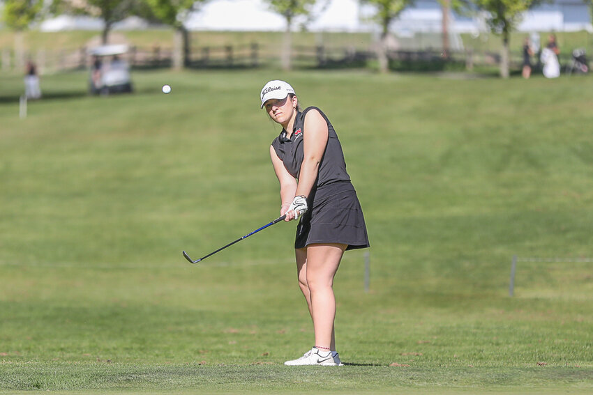 W.F. West's Maddy Alexander chips onto the green during a match during Centralia on May 1.