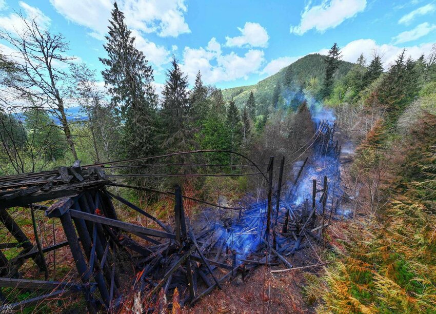 Smoke rises from the trestle bridge that caught fire between Mineral and Morton last week in these photos provided on Sunday by the Mt. Rainier Scenic Railroad.