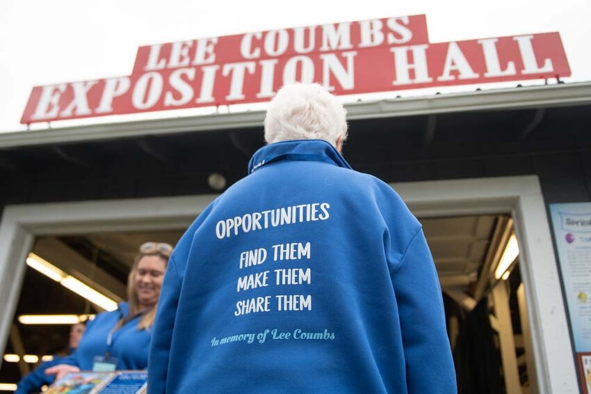 Bonnie Canaday Coumbs sports a sweater honoring her late husband Lee Coumbs during an unveiling ceremony of the newly named Lee Coumbs Exposition Hall at the Southwest Washington Fairgrounds on Friday, May 2.