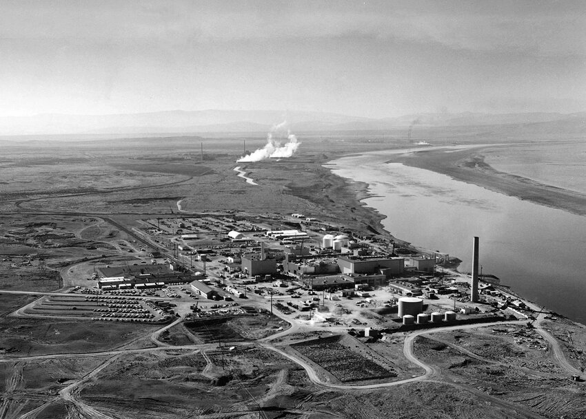 Nuclear reactors line the riverbank at the Hanford site along the Columbia River in January 1960. The site was chosen for its isolated location and proximity to the cold waters of the Columbia, which were used to cool nuclear reactors. (U.S. Department of Energy/TNS)