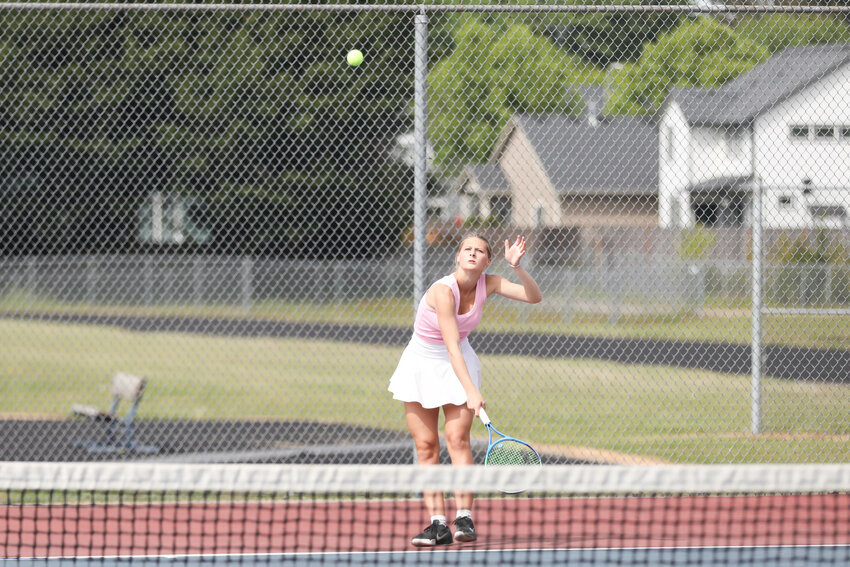 W.F. West's Ellie Mittge serves during the Sub-District Doubles Championship Game at Black Hills on May 6.