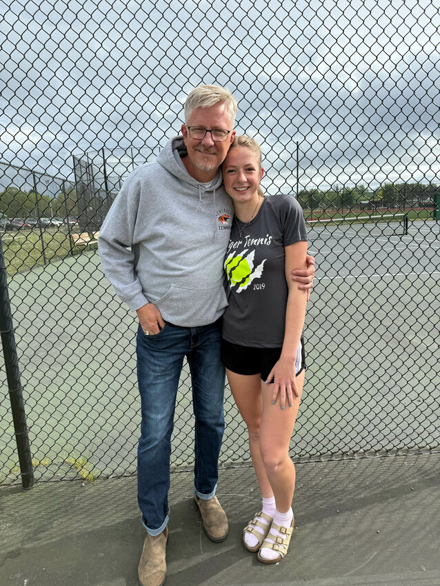 Centralia coach Keith Hopkins and Centralia's Esther Hopkins pose for a photo after Esther Hopkins won the Sub-District Tournament Third-Place Match to seal a spot int he district tournametn at Centralia High School on May 7.