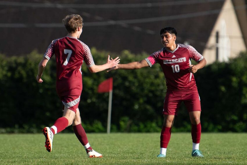 W.F. West&rsquo;s Adrian Jaimes, right, high fives Colin Bradley after a goal during a 5-0 District Tournament win over Washougal in Chehalis on Thursday, May 8.