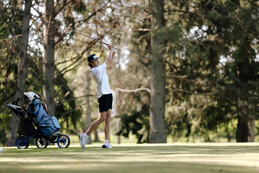 Adna's Trevin Salme hits an approach shot during the district tournament at Mint Valley Golf Course on May 8.