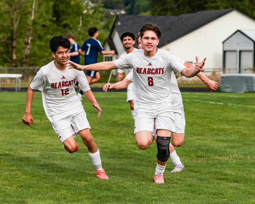 W.F. West's Alex Mathuzima (8) celebrates after scoring one of his two goals in W.F. West's 2-1 win over Hockinson in a district quarterfinal in Hockinson on May 10.