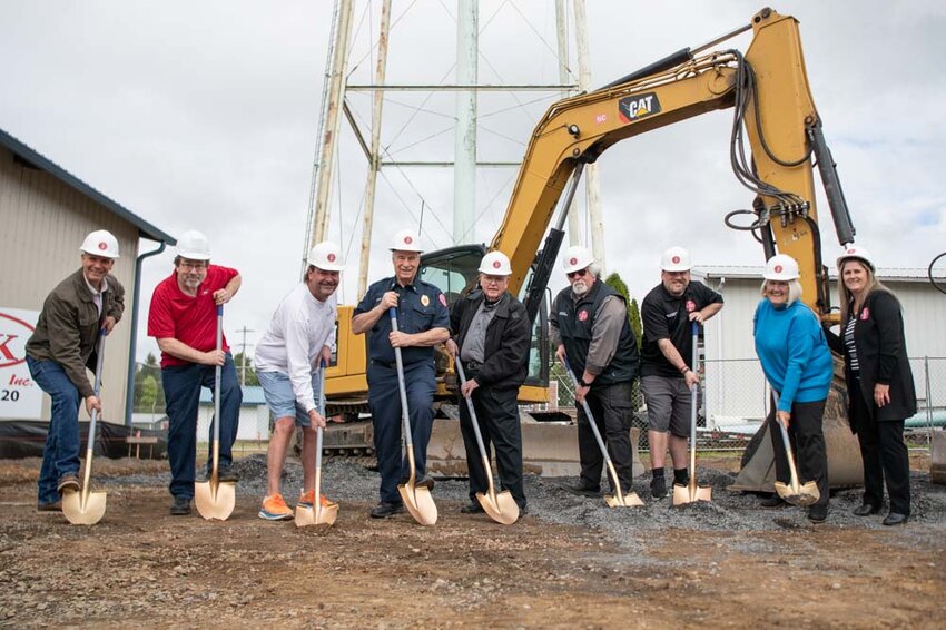 From the left, State Rep. Peter Abbarno, R-Centralia, MDK Construction Sales Manager Steve Barnett, Napavine Mayor Shawn O&rsquo;Neill, Lewis County Fire District 5 Interim Chief Gregg Peterson, Frank Kirkbride, Commissioner Sam Patrick, Commissioner Mike Goodwillie, Commissioner Sandra White, and Secretary Carmen Underdahl pose for a photo during a ground breaking ceremony for the new Lewis County Fire District 5 Apparatus Bay at the District 5 office in Napavine on Monday, May 12.