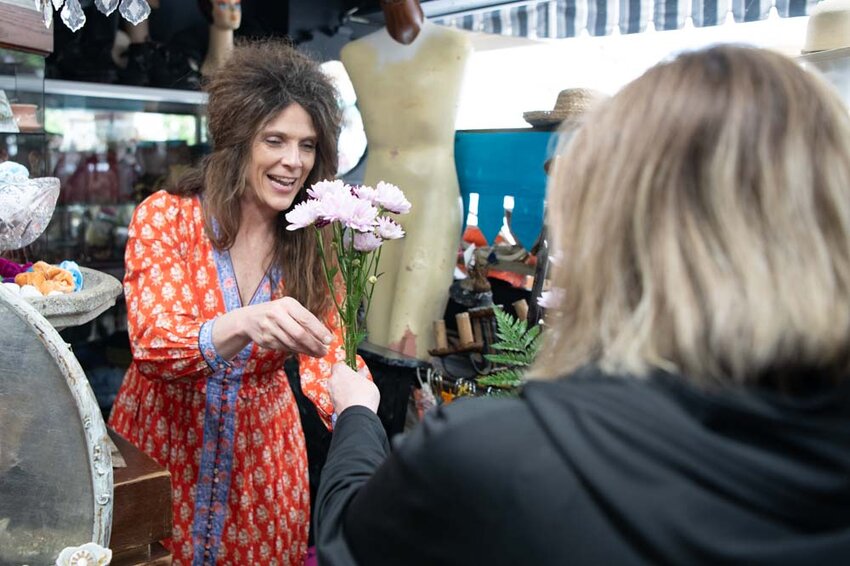 The Shady Lady owner Holly Ryan hands out flowers to participants during the Centralia Downtown Association&rsquo;s Flower Crawl in Centralia on Saturday, May 10. &ldquo;Stroll through downtown and celebrate spring with our Flower Crawl,&rdquo; the downtown association wrote before the event. &ldquo;Visit participating businesses to enjoy beautiful blooms, special deals and seasonal treats while discovering all that downtown has to offer. Grab a map, explore and collect flowers along the way &mdash; because nothing says spring like a little shopping and a lot of petals!&rdquo;