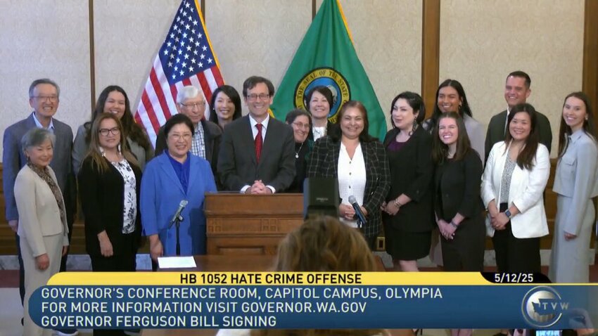 Gov. Bob Ferguson signs expanded hate crimes bill into law May 12, 2025, at the Washington Capitol in Olympia.