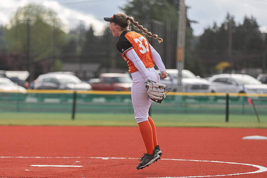Rainier's Elaina Henry celebrates after Rainier defeated Mossyrock 6-2 in the first round of the 2B District 4 Tournament at Fort Borst Park on May 12.