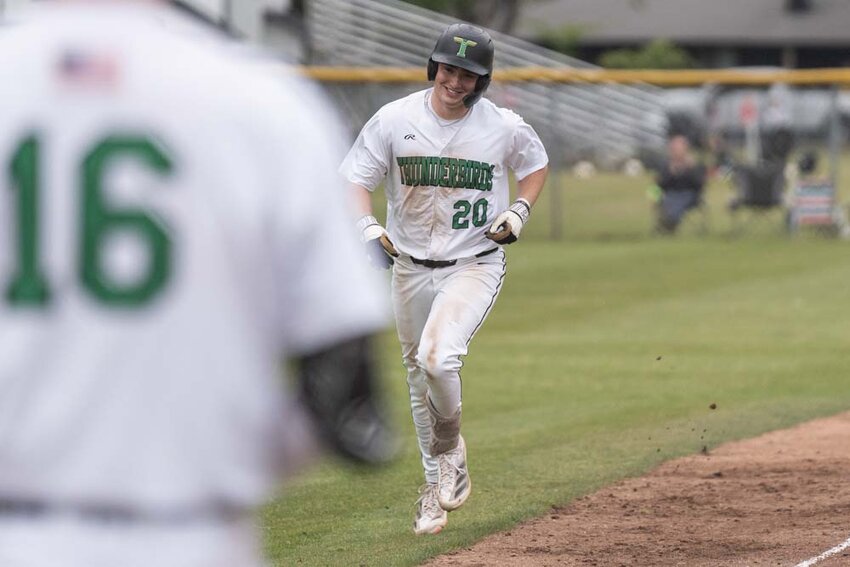 Tumwater&rsquo;s Derek Thompson rounds third after hitting a grand slam during a District 4 Tournament Semifinal win over Ridgefield at Tumwater High School on Tuesday, May 13.