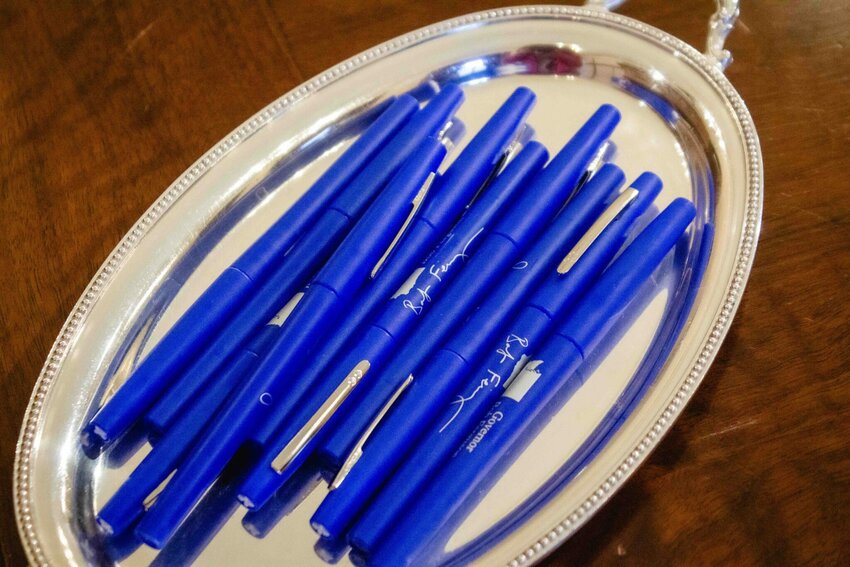 Seen here are the blue pens Gov. Bob Ferguson uses to sign bills. Companies and other interest groups are hoping he'll opt for red veto ink on a range of tax bills.