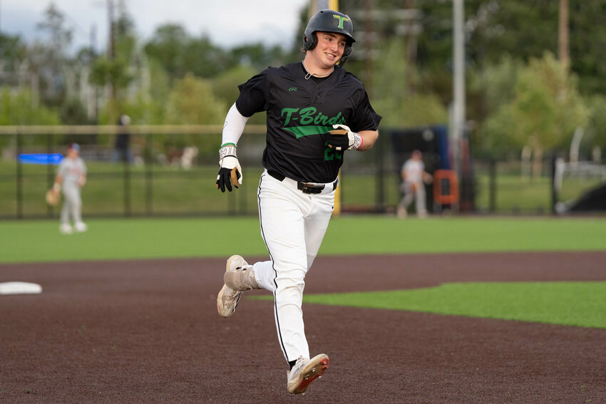 Tumwater&rsquo;s Derek Thompson smiles while rounding third after hitting a walk-off home run to win the 2A District 4 Championship over W.F. West at Ridgefield Outdoor Recreation Complex on Saturday, May 17.