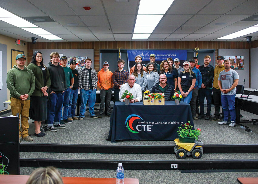 A group of high school students and apprenticeship representatives stand together after the Battle Ground Public Schools Apprenticeship Signing Day at the Lewisville campus in Battle Ground on Thursday, May 15.