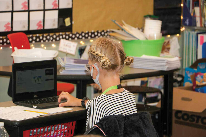 A student at Battle Ground Public Schools uses a Chromebook. The distracted received a $1.4 million federal grant to help purchase more units and reimburse internet hotspot costs in 2021.