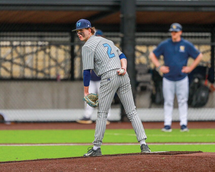 Hockinson&rsquo;s Tyler Fehrer checks the runner at first base during the Hawks&rsquo; 4-1 loss to Aberdeen High School that ended their season on Saturday, May 17, at the Ridgefield Outdoor Recreation Complex.