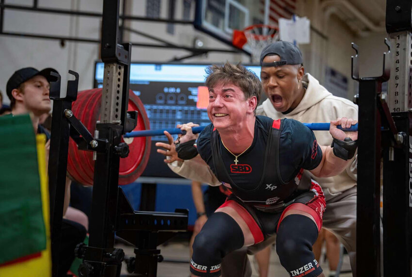 Senior powerlifter Mason Embrey attempts a back squat during the 2025 state powerlifting competition on May 3.