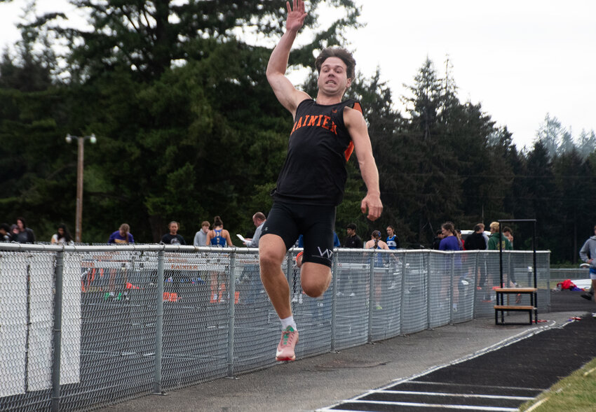 Josh Meldrum breaks the Rainier school record in the long jump at the Central 2B League Championships at Rainier High School on Friday, May 16.