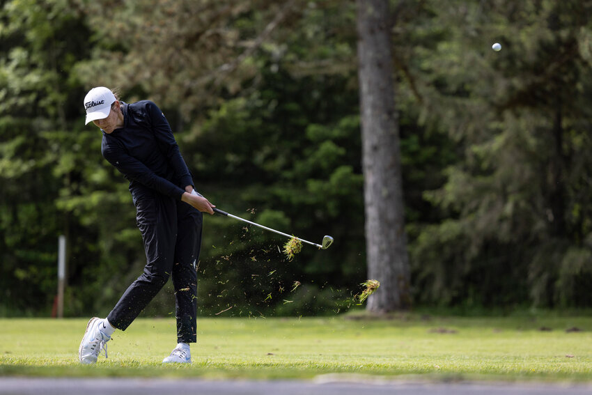 Black Hills&rsquo; Ellie Johnson chips the ball onto the green during the first round of the Class 2A girls state golf tournament at Tumwater Valley Golf Club on Tuesday, May 20.