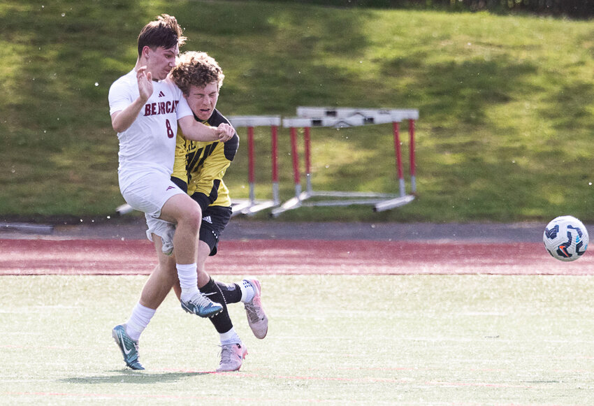 W.F. West junior forward Alex Mathuzima collides with Sehome's Bane Mitchell during the Bearcats' 2-1 loss in the opening round of the 2A Boys State Soccer Tournament in Bellingham on May 21.