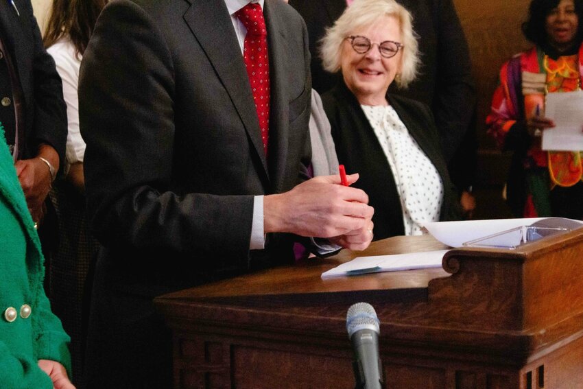 Gov. Bob Ferguson using a red pen to partially veto a bill on Tuesday, May 20, 2025. (Photo by Jacquelyn Jimenez Romero/Washington State Standard)