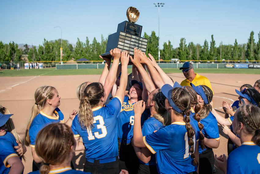 Adna players lift the 2B Softball State Championship trophy after a 10-6 win over Freeman in the state title game at Gateway Sports Complex in Yakima on Friday, May 23.