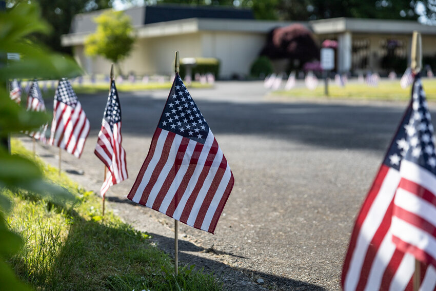 American Flags line the Sticklin Funeral Chapel&rsquo;s driveway in Centralia on Friday, May 23.