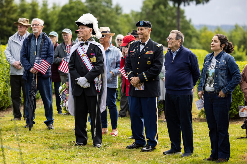 Community members and veterans listen during a Memorial Day ceremony at the Claquato Cemetery in Chehalis on Monday, May 26.