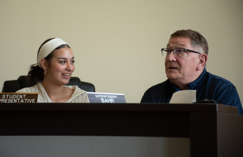 Student Representative Sarah Barry smiles at a comment made by Superintendent Bryon Bahr at a Rainier School District Board of Directors meeting on April 23, 2025.