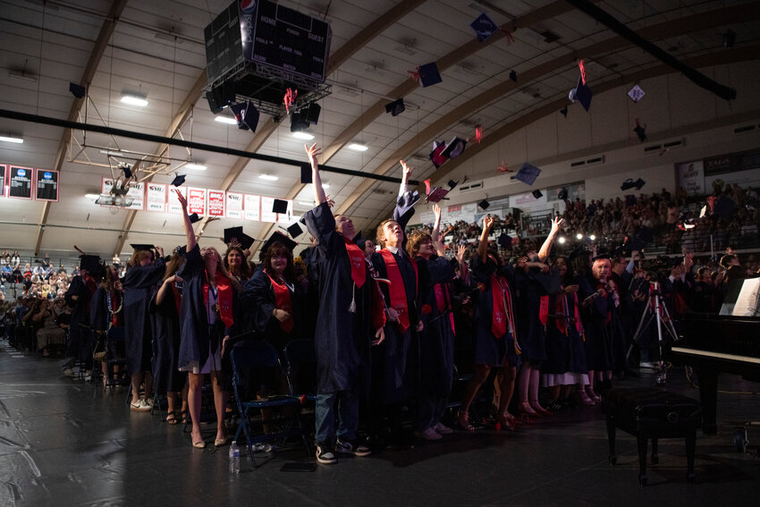Graduates toss their caps during the Black Hills High School Class of 2025 Commencement Ceremony at St. Martin's University in Lacey on Thursday, June 6.