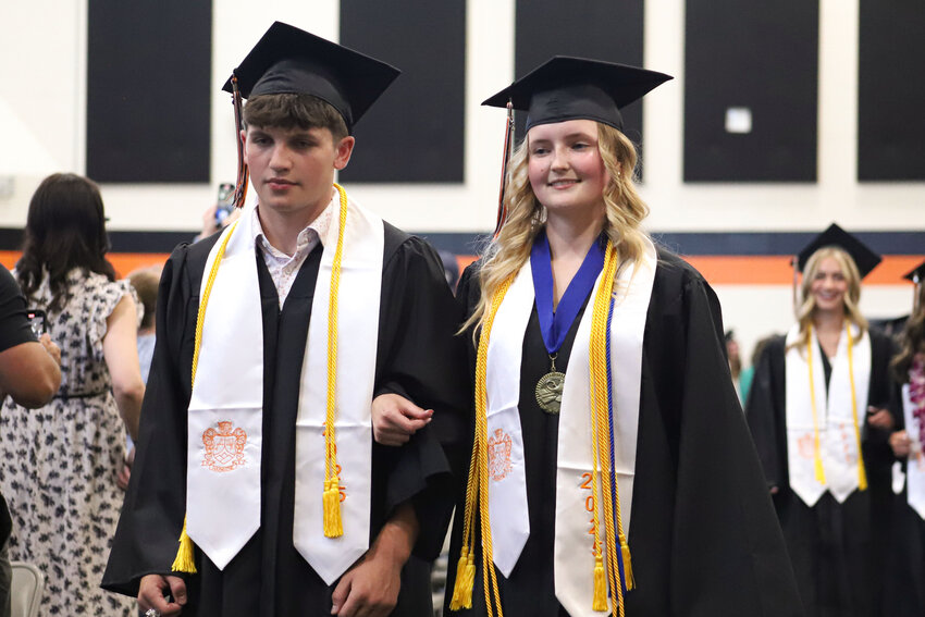 Salutatorian Cayle Kelly and Valedictorian Emma Stewart walk into the gymnasium during Napavine High School's Class of 2025 graduation ceremony on Saturday, June 7.