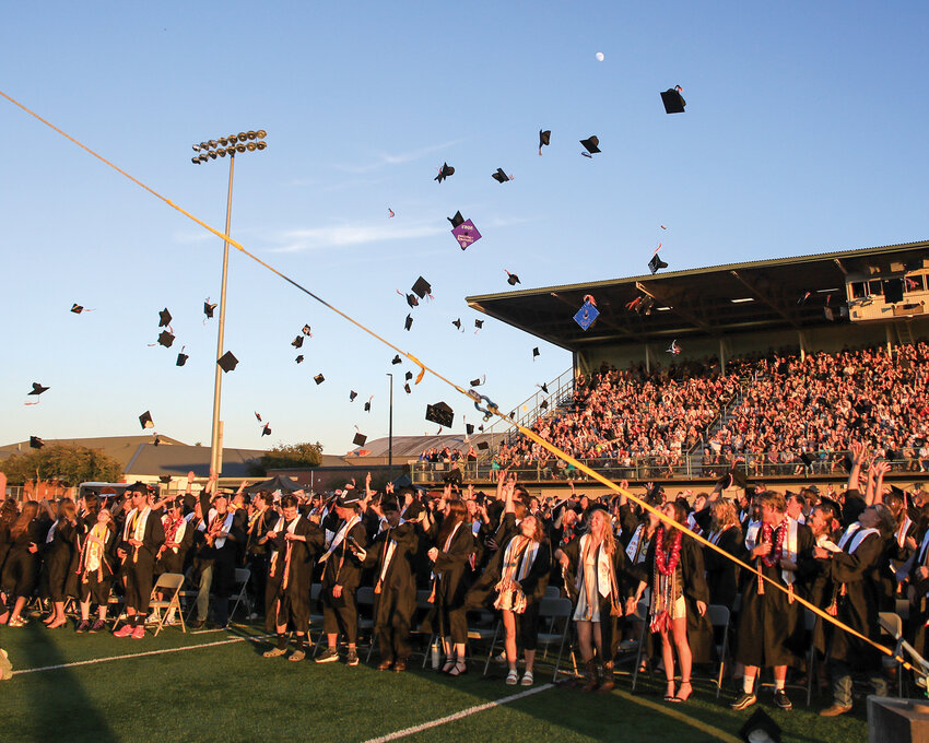 Caps are tossed into the air at Battle Ground High School&rsquo;s 110th annual commencement ceremony on Friday, June 6, as the Tigers&rsquo; 2025 class graduates.