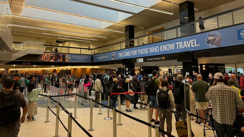 A long line goes through the Transportation Security Administration checkpoints at Seattle-Tacoma International Airport.