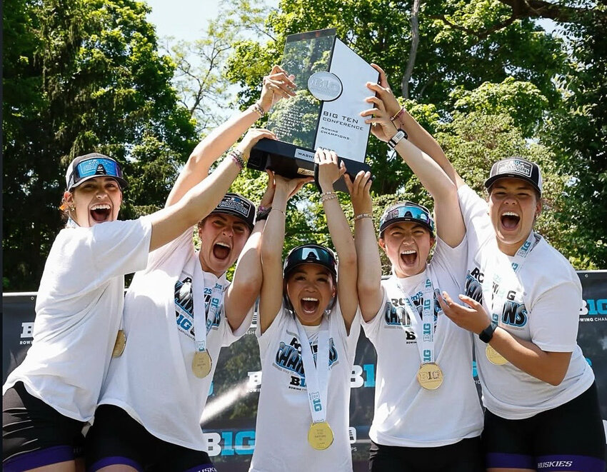 Rochester High School and Centralia College alum Sofie Sand (right) and her teammates hoist the Big Ten Championship Trophy after winning the conference title at the Big Ten Rowing Championships in Indianapolis, Indiana on May 18.