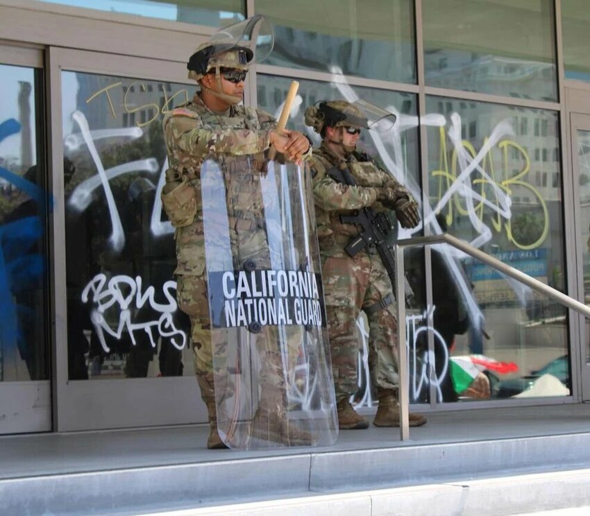 California National Guard members guard the entrance to a federal buidling on Los Angeles Street in downtown Los Angeles on June 10, 2025.