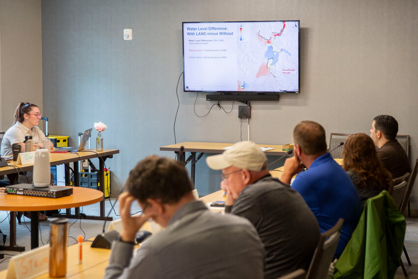 Members of the Chehalis Basin Board, including Lewis County Commissioner Scott Brummer, center left, ask questions about a levee and flood impact study during a board meeting on June 5.