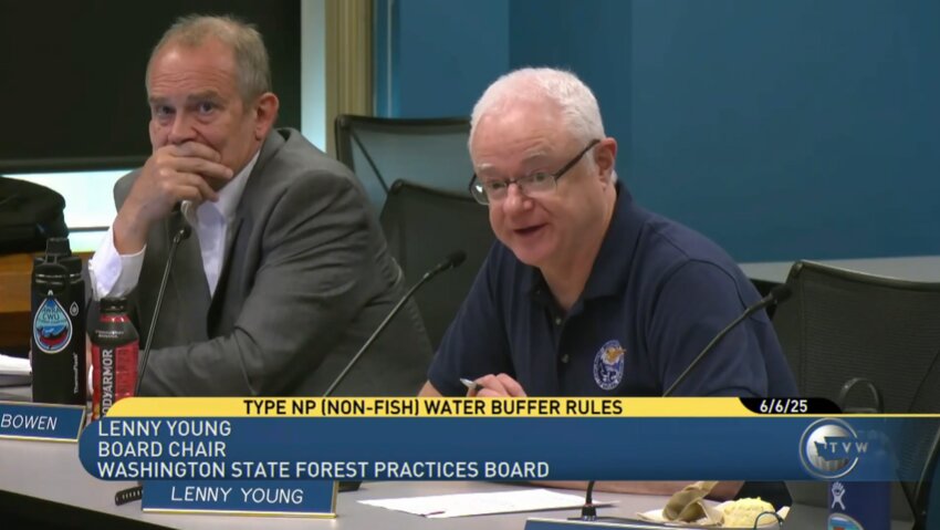 Forest Practices Board Chair Lenny Young, right, who represents the Washington state department of Natural Resources, discusses the board's next steps in the rule making process for a proposed stream buffer rule.