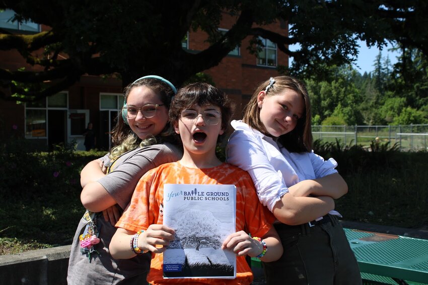 Tukes Valley students pose with editor-in-chief Rye Dilley (middle) after publishing the first issue of the newly relaunched district magazine.