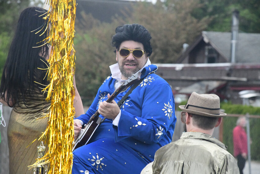 An Elvis Presley impersonator cruises down Yelm Avenue in Saturday, June 14's Prairie Days Parade.