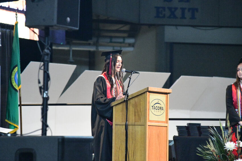 Yelm High School graduate and valedictorian Brook Smith delivers a speech to her classmates and those in attendance on Sunday, June 15 in the Tacoma Dome.