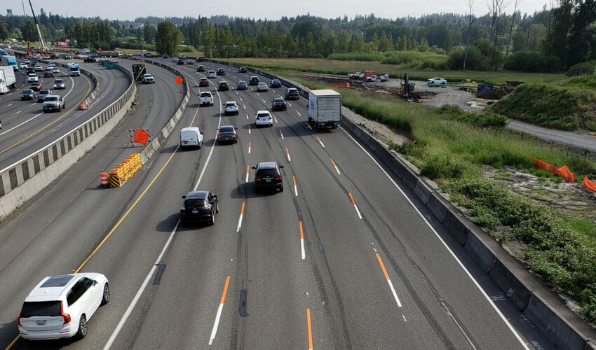 Vehicles travel through a construction zone near Fife, on Interstate 5 in June 2023. (Washington State Department of Transportation)