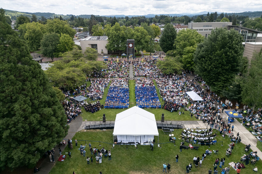 Centralia College graduates and their families gather on Littel Commencement Field during the Centralia College class of 2025 commencement ceremony on Wednesday, June 18.