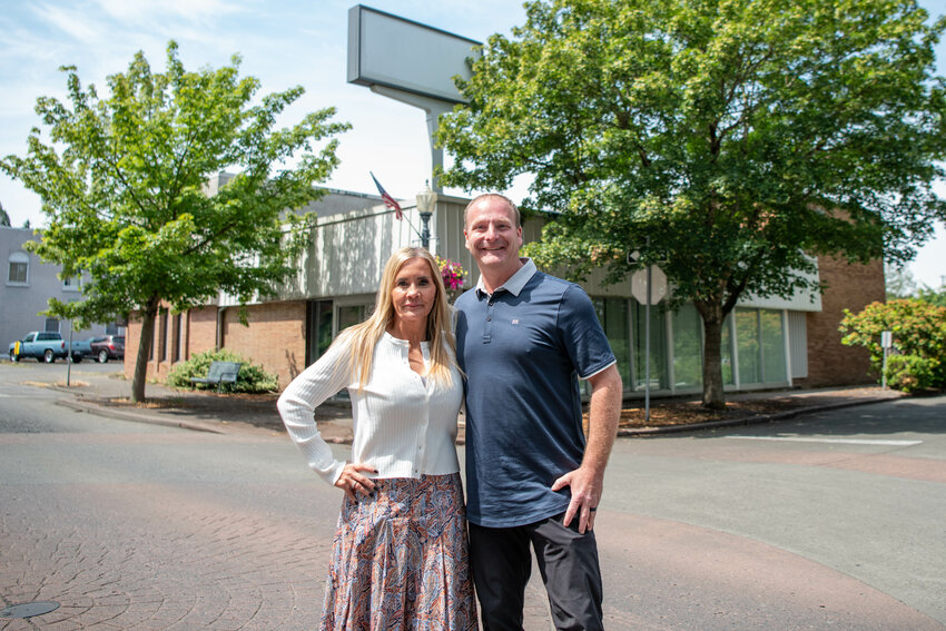 Publisher Chad Taylor and CEO Coralee Taylor smile for a photo outside of The Chronicle&rsquo;s newly acquired building on North Pearl Street in downtown Centralia on Monday, June 23.