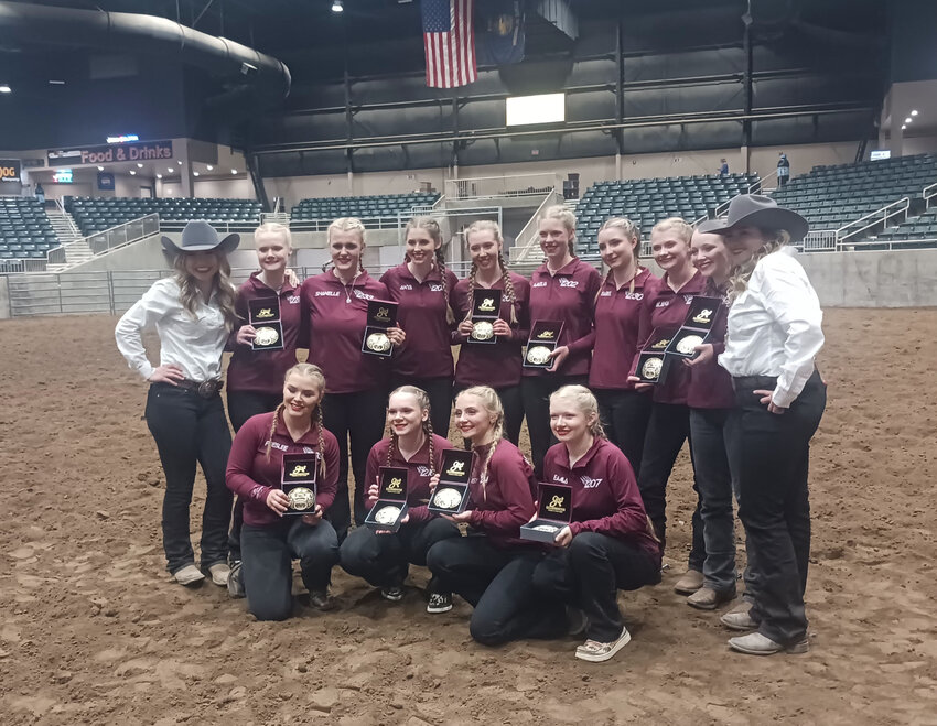 The W.F. West equestrian drill team poses for a photo with their first-place belt buckles at the Pacific Northwest Invitational Championship in Redmond, Oregon.