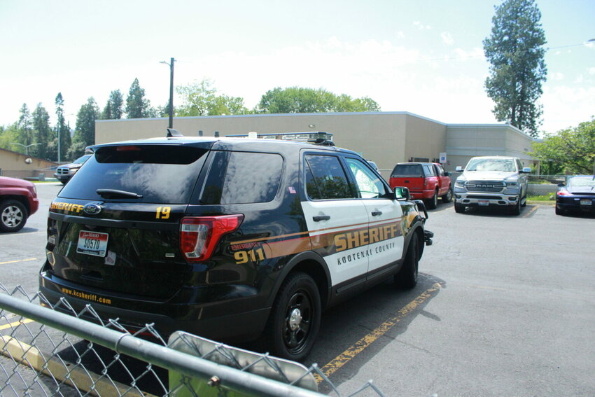 In this June 2022 file photo, a Kootenai County sheriff&rsquo;s car is parked outside the justice building. (Photo by Anteia McCollum/Idaho Capital Sun)