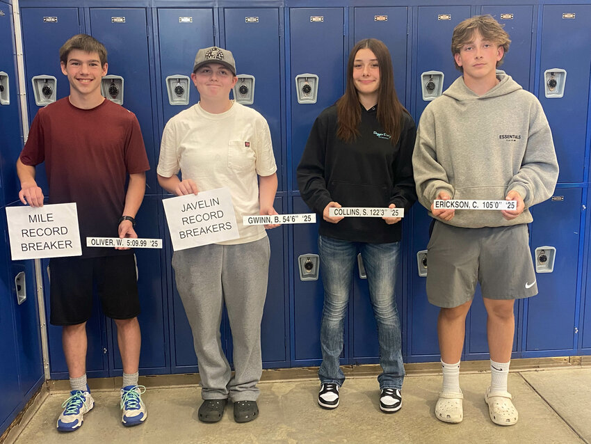 Centralia Middle School's Wyatt Oliver, Bailey Gwinn, Skyla Collins, and Caden Erickson pose for a photo with their school records at Centralia Middle School.