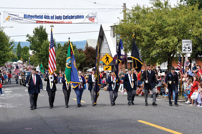 Veterans from Ridgefield&rsquo;s American Legion kicked off the city&rsquo;s Fourth of July parade Friday morning, earning loud applause. Thousands lined the streets of downtown as Ridgefield&rsquo;s annual Fourth of July celebration continued. The parade ran from Third Avenue to Pioneer Street and up Eighth Avenue. From Ridgefield High School&rsquo;s Spudder to lasso-spinning riders, the event brought out a wide range of community groups, performers and local icons.