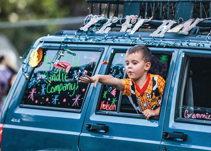 Candy is tossed from floats during the 2024 Twilight Parade in La Center. This year&rsquo;s parade begins at 8 p.m. Friday, July 25, and will carry a &ldquo;Going Renaissance&rdquo; theme.