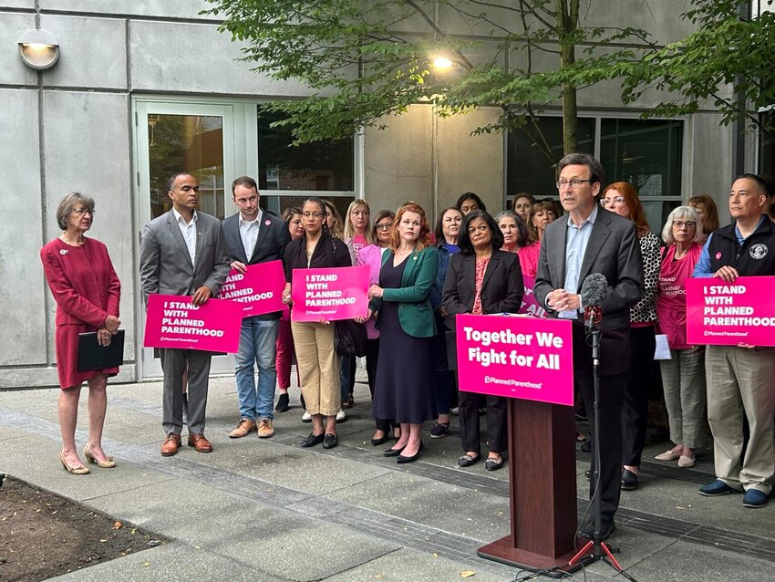 Washington Gov. Bob Ferguson speaks to reporters about federal cuts to Medicaid funding outside a Planned Parenthood clinic alongside advocates, state lawmakers and statewide elected officials on Wednesday, July 9, 2025, in Seattle. (Photo by Jake Goldstein-Street/Washington State Standard)