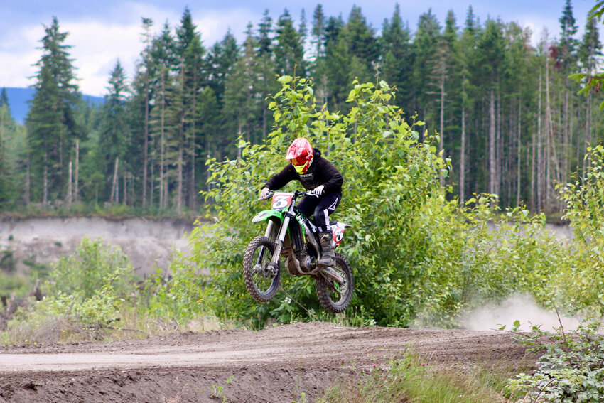 Ethan Hernandez rides his dirt bike down the track.