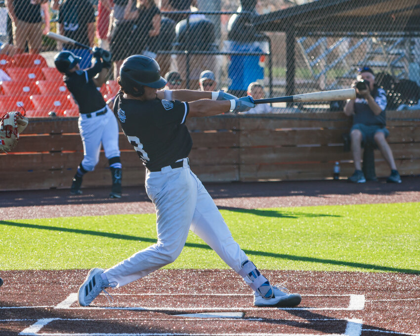 Ridgefield Raptors second baseman Evan Jaquez sports a Battle Ground Police Department patch on his jersey during their 4-2 win over the Corvallis Knights on first responder night.